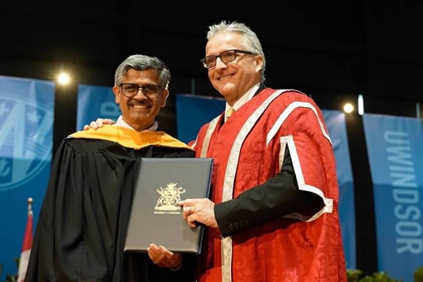 Ram Balachandar accepts congratulations from UWindsor president Robert Gordon