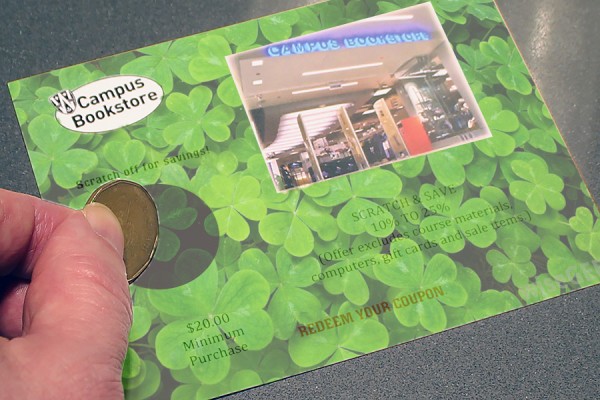 hand scatching ticket covered with clovers