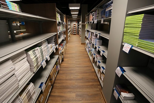 Aisles of textbooks in the Campus Bookstore.