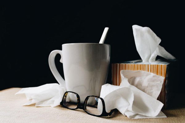 workspace with coffe and crumpled tissues