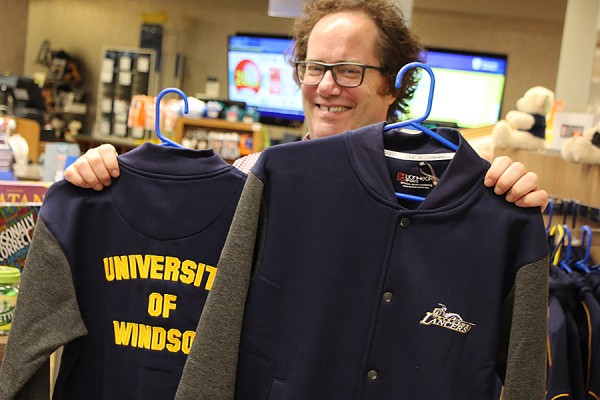 Martin Deck shows off a fleece varsity jacket available in the Campus Bookstore.