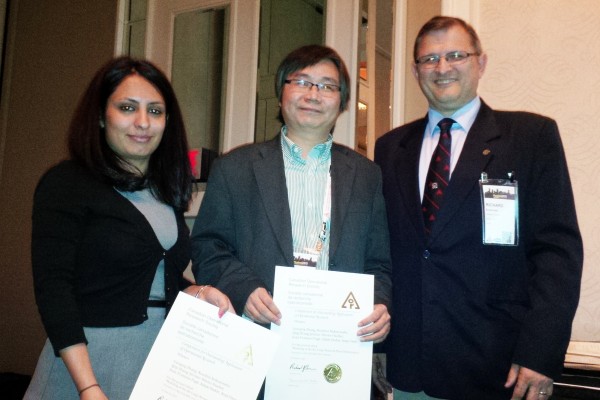 PhD student Nooshin Nekoiemehr (l.) and engineering professor Guoqing Zhang (centre) accepted congratulations from chief judge Dr. Richard Caron (r.) for receiving the first practice prize at the national conference of the Canadian Operational Research So