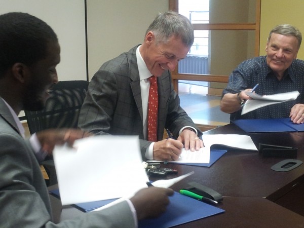 President Alan Wildeman, joined by UWindsor Student Alliance president Jaydee Tarpeh (l.) and Organization of Part Time University Students president Ed King (r.) signed an agreement to continue joint operation of CAW Student Centre, Tuesday. 