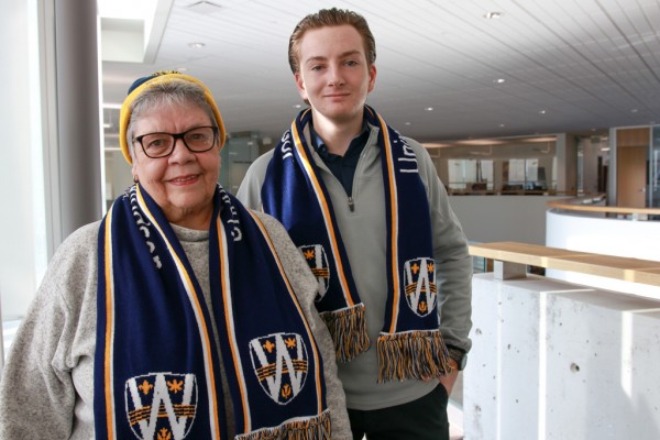 Joyce Garvey and her grandson Josh Galasso wearing UWindsor toques and scarves