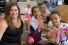 Melissa Caschera with kids holding books