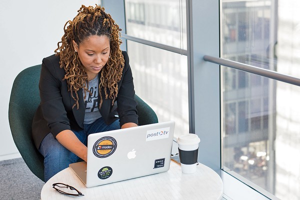 woman sitting at laptop computer