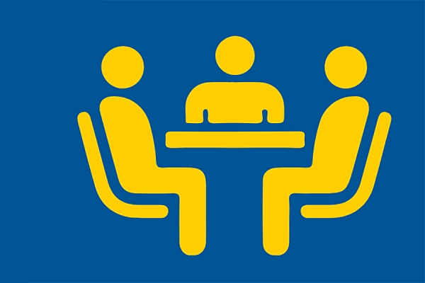 cartoon of people sitting around conference table