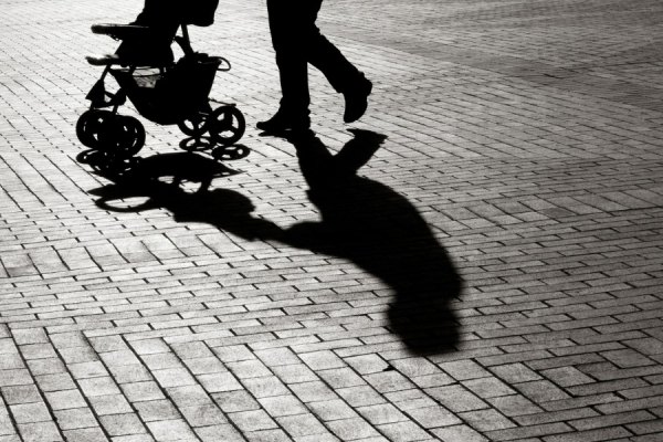 shadow of mother pushing stroller
