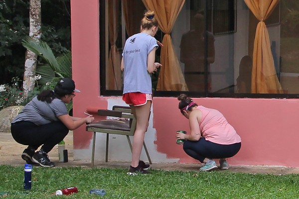 UWindsor students add a fresh coat of paint to the head office of the local water authority in Peñas Blancas.