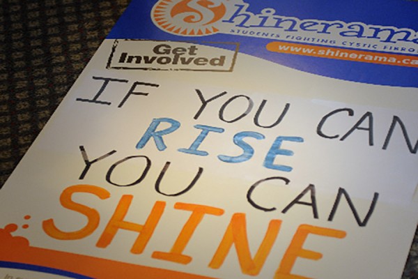 hand-lettered sign: &quot;If you can rise, you can shine&quot;