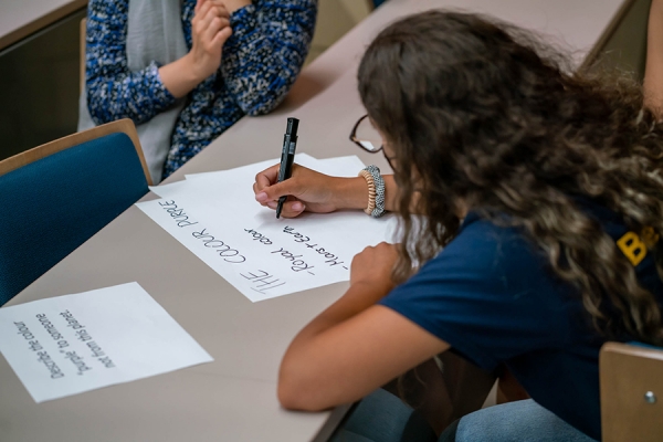 students writing notes