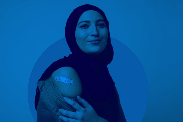 woman displaying vaccine bandage