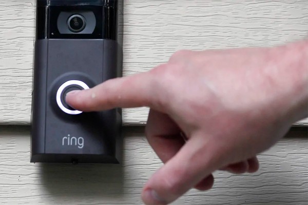 finger on doorbell
