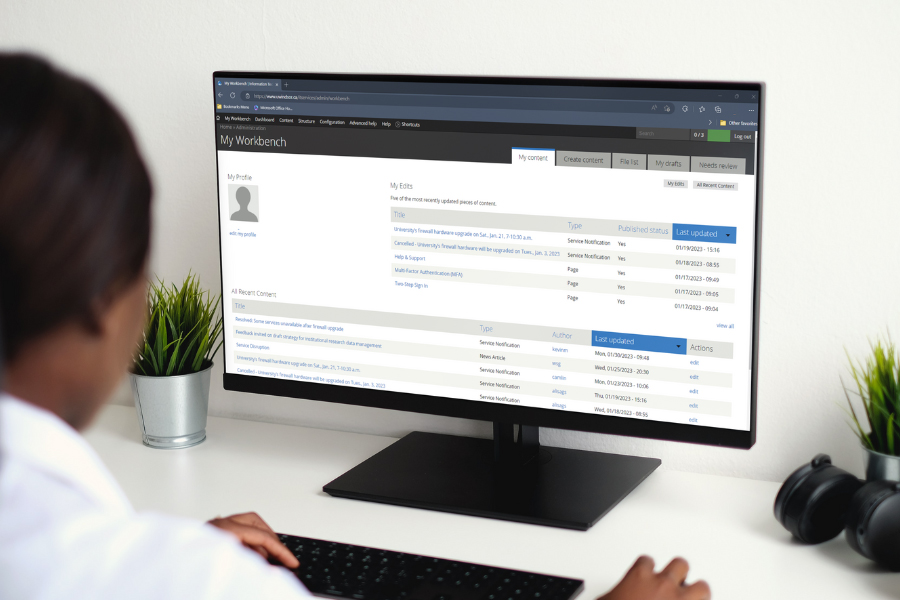 woman looking at computer screen displaying Drupal