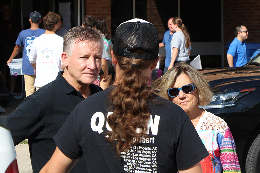 Douglas Kneale (left) and his wife Barb Davis (right) speak with Ragn Royle, 