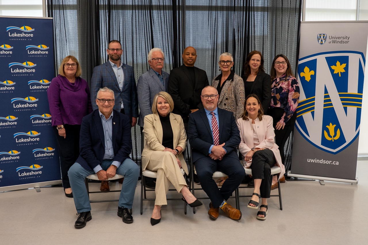 University of Windsor President and Vice-Chancellor Dr. Robert Gordon and Lakeshore Mayor Tracey Bailey, joined by representatives from UWindsor and the Municipality of Lakeshore, celebrate the signing of a Memorandum of Understanding at the Atlas Tube Recreation Centre on May 20, 2025. The partnership will support innovation, local housing development, and expanded opportunities for students and communities across the region. (Photo by UWindsor)