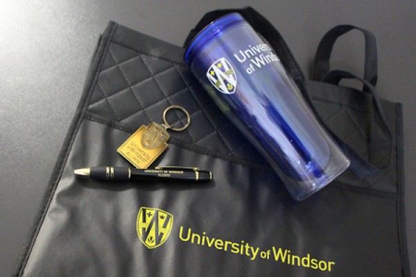 quilted carry-all bag, acrylic tumbler, pen, key ring