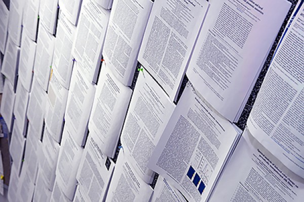 abstracts thumbtacked to corkboard