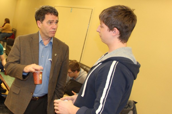 Clayton Smith shares a word and some hot chocolate with Austin Vojvodin