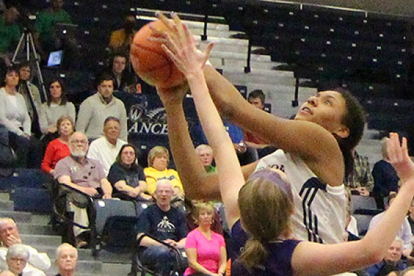 Lancer third-year player Cheyanne Roger battles through for a shot.