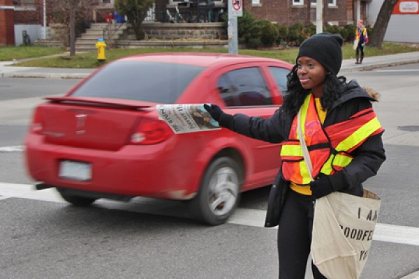 Lancer sprinter Esinam Ayesu-Attah hawks Goodfellow newspapers, Thursday on Wyandotte Street West.