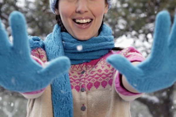 woman wearing fleece mittens