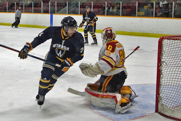 Dylan Denomme dekes a goalie