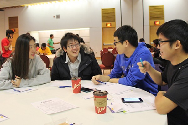 Students share a smile during the student development workshop hosted by the International Student Society.