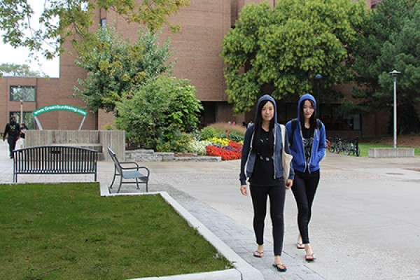 students walking in front of Leddy Library