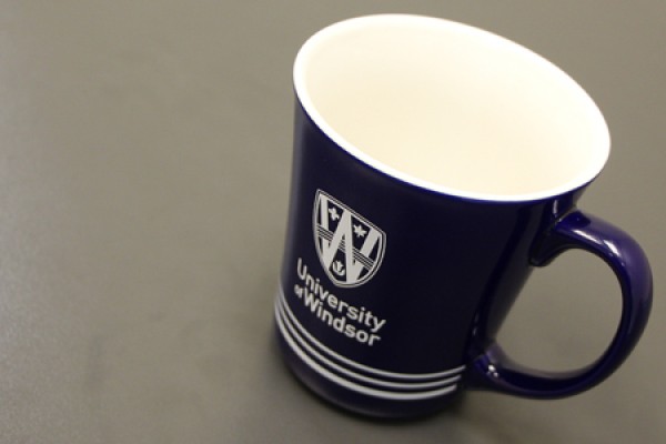 big beautiful coffee mug bearing UWindsor logo