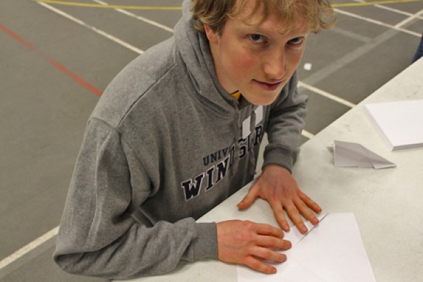 Paul Borger, a master’s student in engineering, folds an airplane design in preparation for competition. His 24.82 m flight was good for second place.