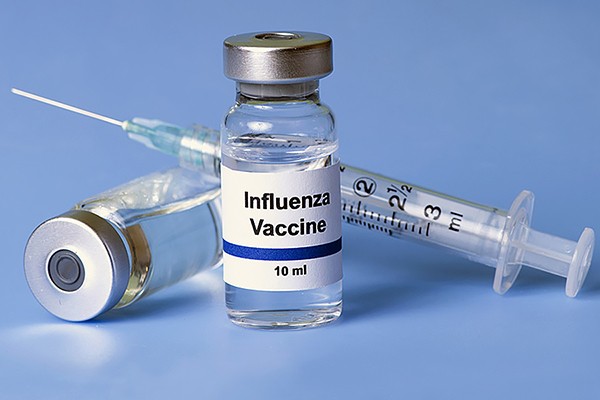 syringe and vial of vaccine