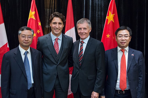 Wenxun Lin, president of Yunnan University; Justin Trudeau, prime minister of Canada; Alan Wildeman, president of University of Windsor; and Ping Dong, chair of the board of directors, Bohong Group.