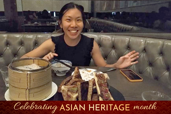 Anita Hu in front of plate of food