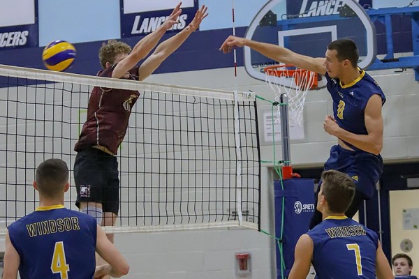 Brad Gyemi scores a point for the Lancer volleyball team.