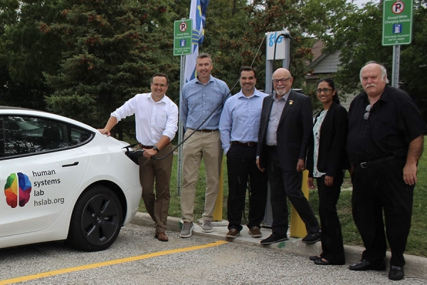 Windsor-Tecumseh MP Irek Kusmierczyk, Essex Power Corporation chief operating officer Steve Ray and president John Avdoulos, UWindsor sustainability officer Nadia Harduar, and facility planning manager Danny Castellan