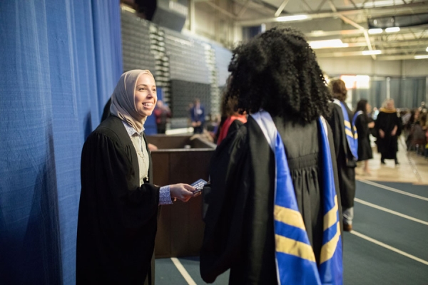 woman greeting graduand