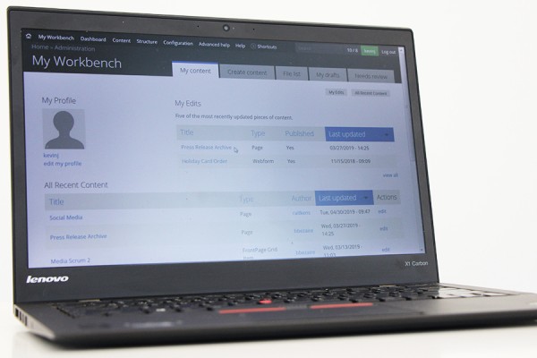 laptop displaying Drupal screens