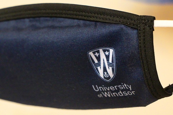 Face mask with UWindsor shield on it