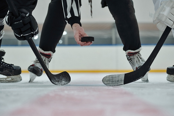 referee and skaters at faceoff