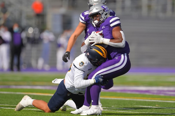 Lancer defensive player tackling Western ball carrier