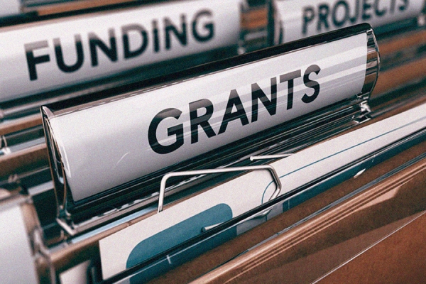 file folders reading "Funding" and "Grants"
