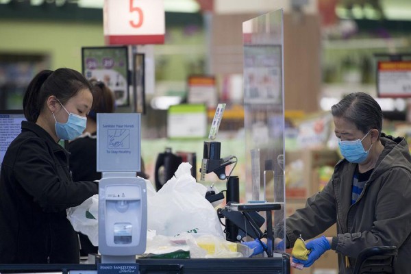 person paying for groceries in store