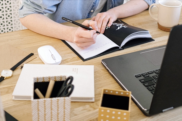 person reading book, working on computer