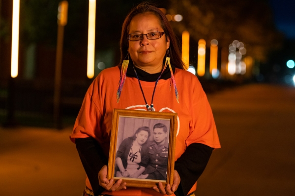 Jaimie Kechego holding a photograph of her grandparents