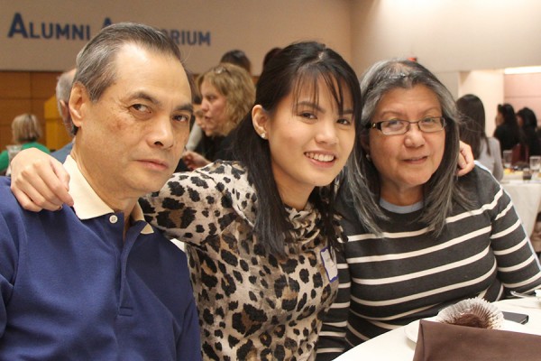 Katrina Camince (centre) is congratulated by her parents Willy and Maria