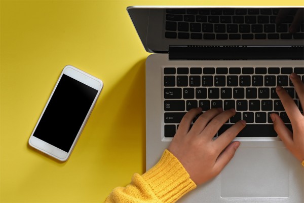 hands on laptop computer keyboard
