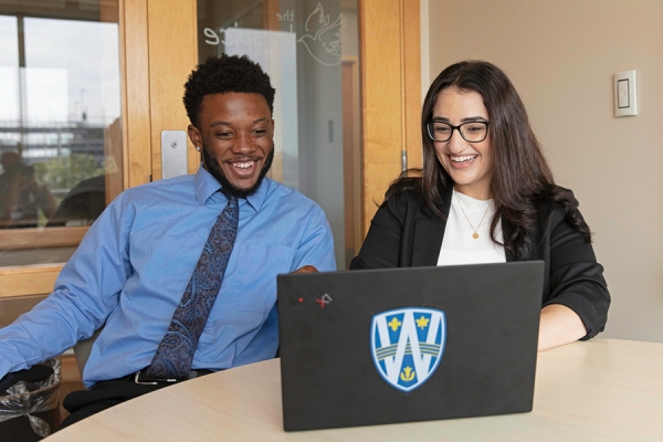 happy students consult computer