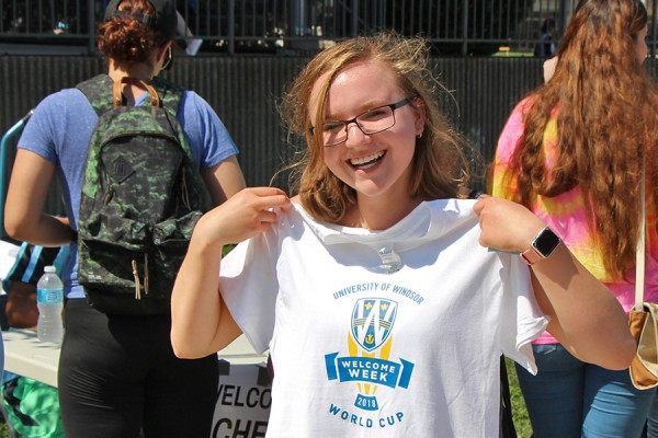 Madison Hearn holds up a T-shirt