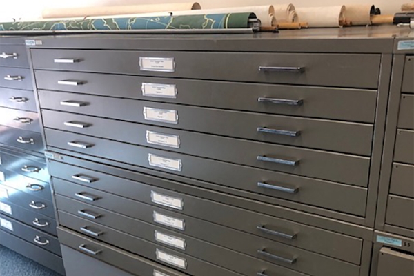 a large cabinet with flat drawers